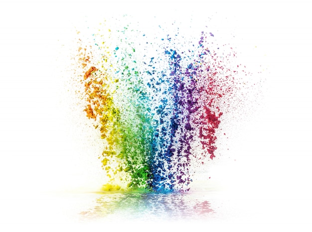 Photo explosion of colored powder on white background