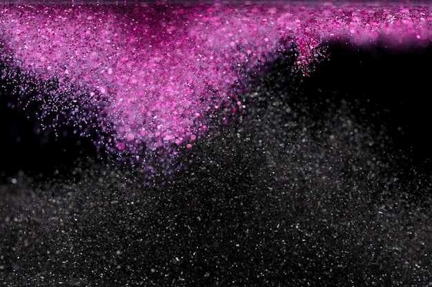 Explosion metallic pink black glitter sparkle Choky Glitter powder spark blink celebrate blur foil explode in air fly throw pink glitters particle Black background isolated series two of images