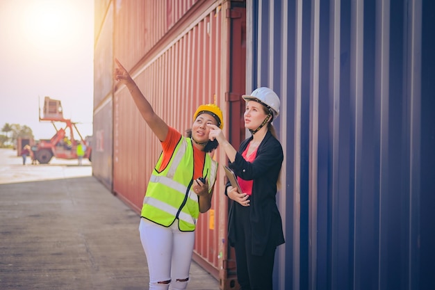 Export management team is inspecting the containers to manage\
the export of goods to foreign countries lager cargo shipment