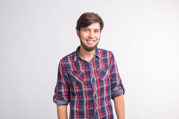 Expression and gesture concept - Handsome man laughing over white wall