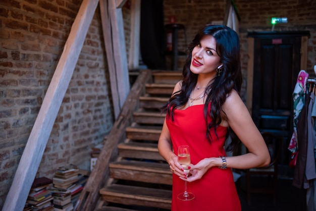 Expressive beautiful woman posing in evening dress