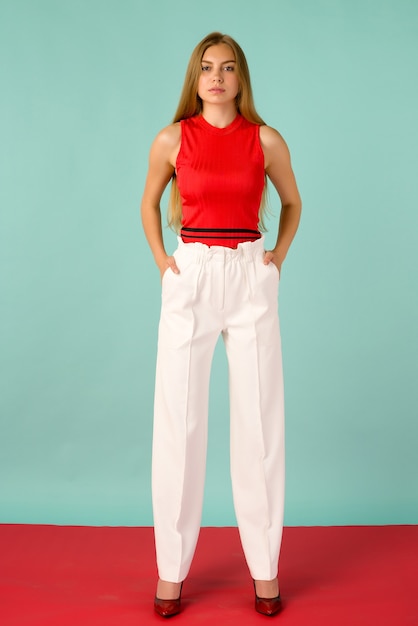 Expressive beautiful young woman posing in modern cloths