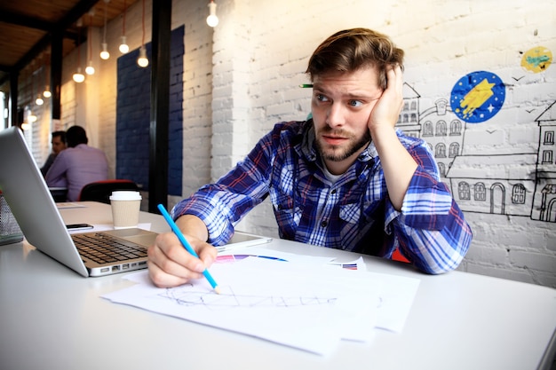 Expressive businessman posing