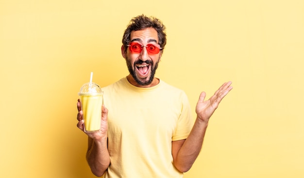 Expressive crazy man feeling happy and astonished at something unbelievable