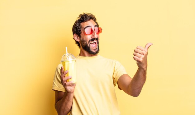 Expressive crazy man feeling proud,smiling positively with thumbs up