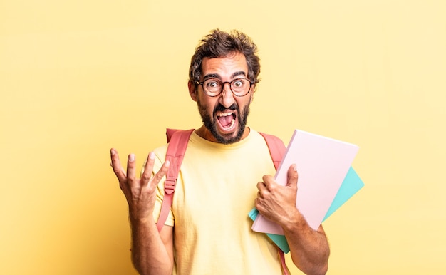 Expressive crazy man looking angry, annoyed and frustrated. adult student concept