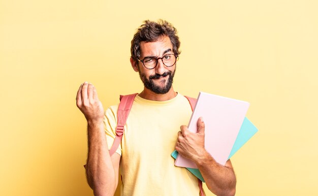 Expressive crazy man making capice or money gesture, telling you to pay. adult student concept