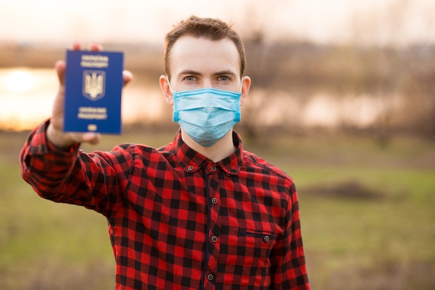 Expressive man posing with medical face mask