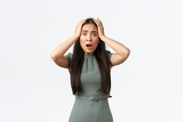 Expressive young Asian woman posing