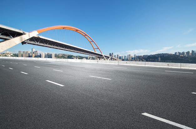 The expressway and the modern city skyline are in Chongqing, China.