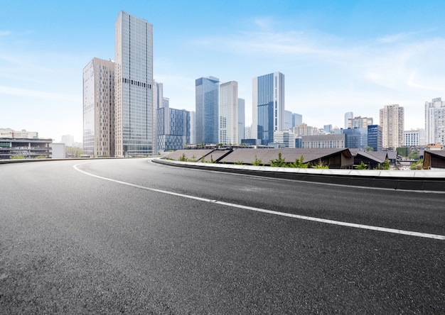 The expressway and the modern city skyline are in Chongqing, China.