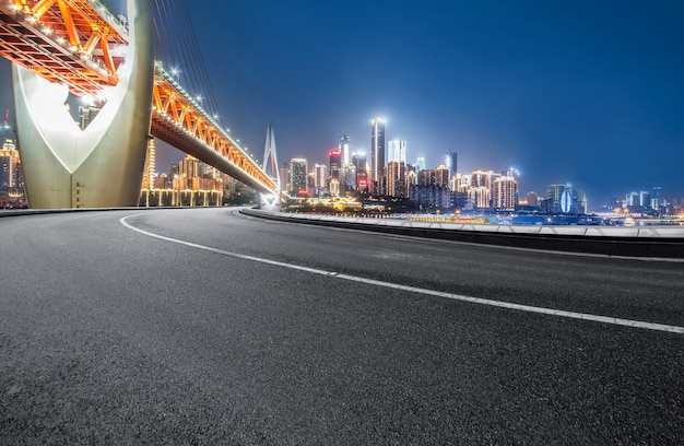 The expressway and the modern city skyline are in Chongqing, China.