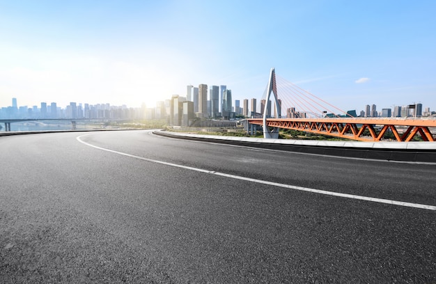 The expressway and the modern city skyline are in Chongqing, China.