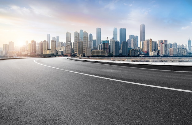 The expressway and the modern city skyline are in Chongqing, China.