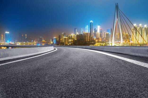 The expressway and the modern city skyline are in Chongqing, China.