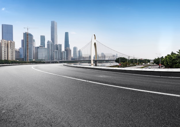 The expressway and the modern city skyline are in guangzhou, China.