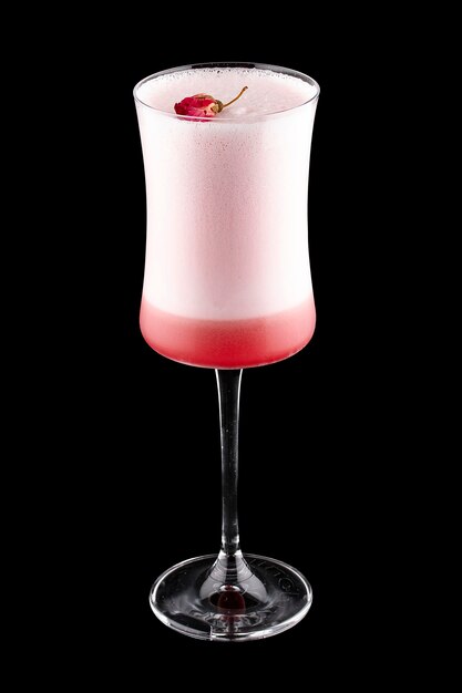 Exquisite cold cocktail with gin and raspberry liqueur on a dark background