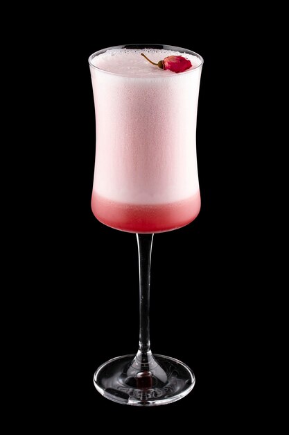 Exquisite cold cocktail with gin and raspberry liqueur on a dark background