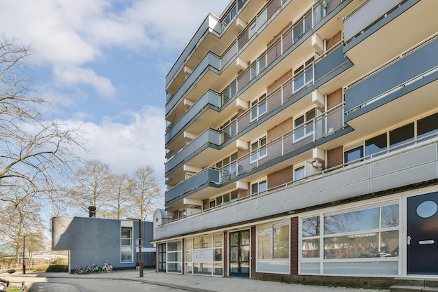 The exterior of an apartment building with a sidewalk and