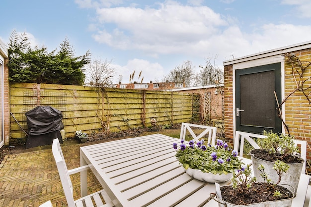 The exterior of the backyard with sitting area