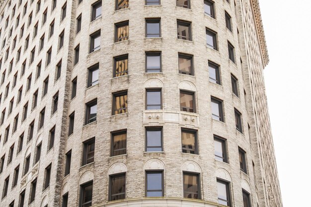 The exterior of a building with a large window on the top.