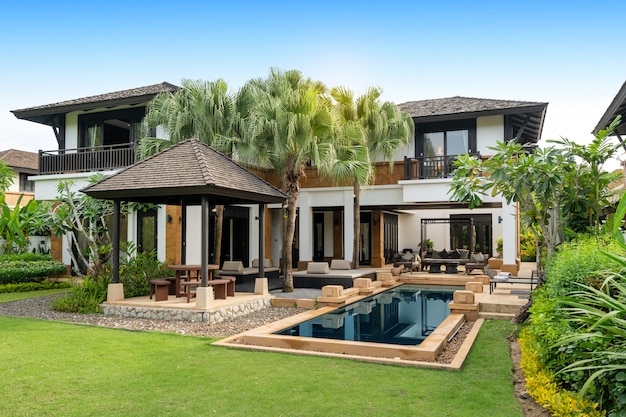 Exterior design of house, home and pool villa feature swimming pool, terrace, landscape garden and sun bed