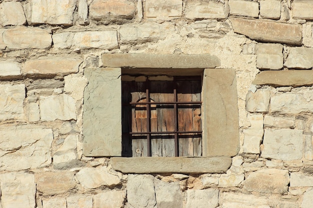 Exterior facade with window through the streets of Montfalcó Murallat.