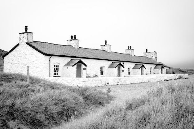 Exterior of house on field against clear sky