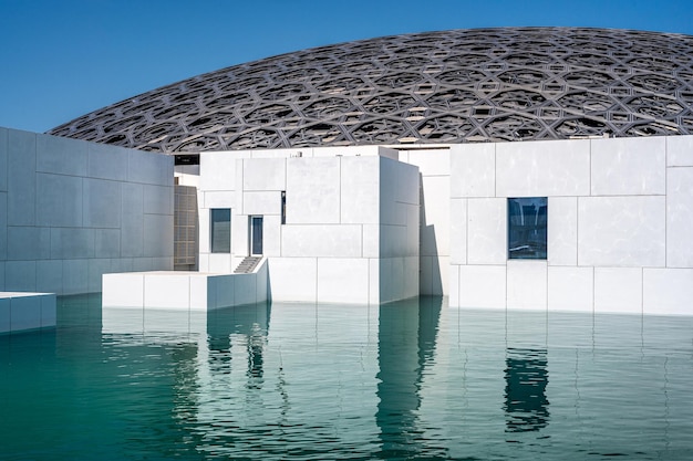 Exterior of Louvre Abu Dhabi famous museum View of Louvre showing Rain of Light Dome