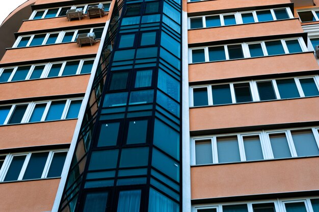 Exterior of a modern multistory apartment building Facade windows and balconies