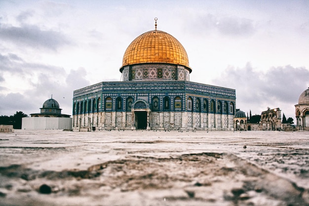 Exterior of mosque against sky in city