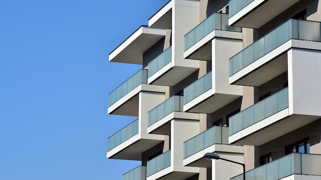 Exterior of new apartment buildings on a blue cloudy sky background No people