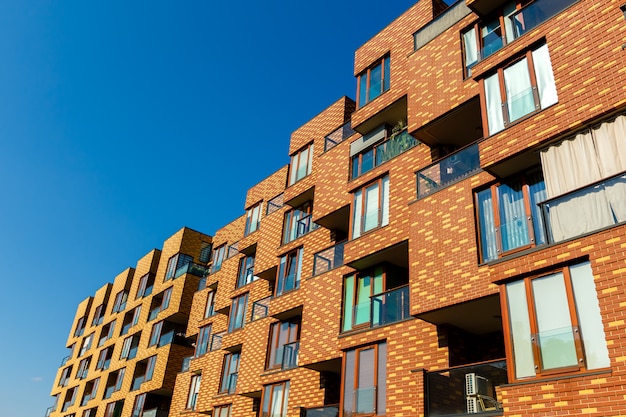 Exterior of new  apartment buildings on a blue sky background