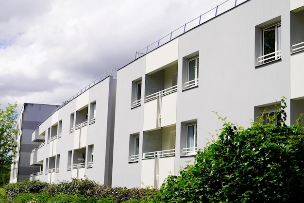 Exterior of new white modern architecture residential building in street