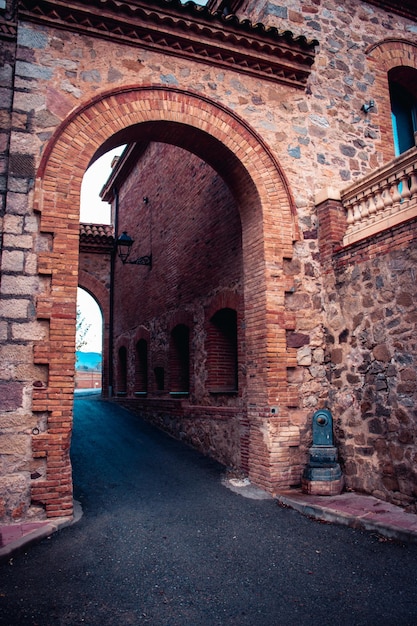 The exterior of an old farm concept photo An arch through which you can see the backyard