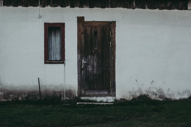 Exterior of old house on field