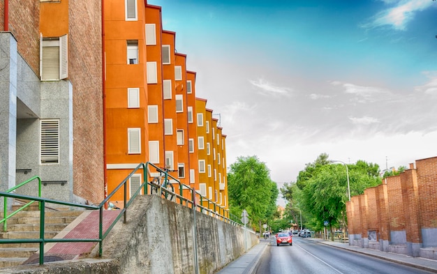 Exterior of orange geometrical buildings in the street