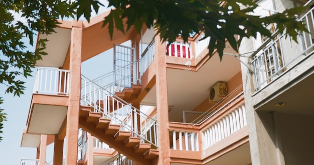 Exterior stairs between levels of multistorey house