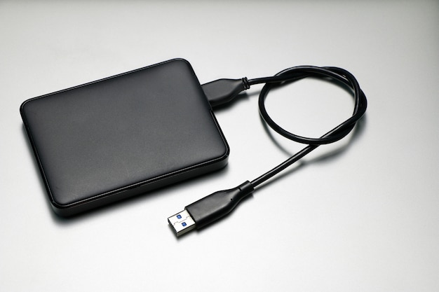 Photo external hard drive for backup on gray background