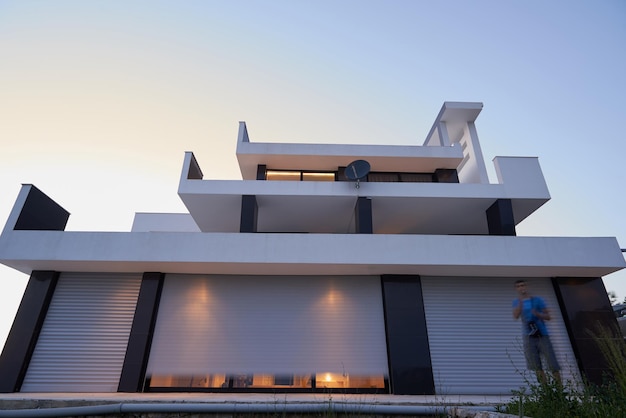 External view of a contemporary house modern villa at  sunset