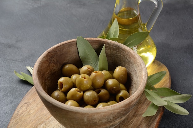 Extra virgin olive oil, olive branch, and olives