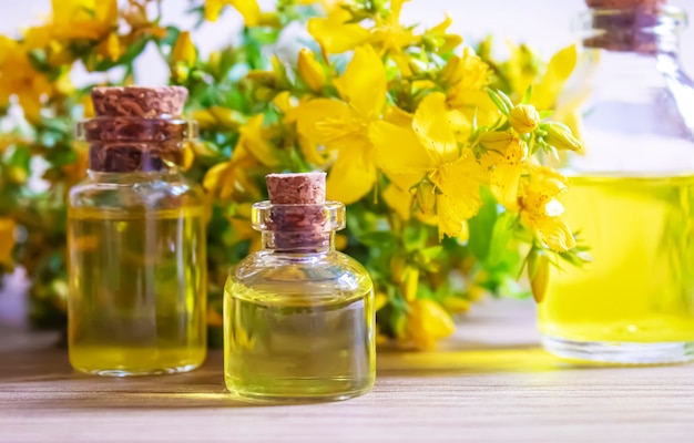 Extract St. John's wort in a small jar. Selective focus.nature