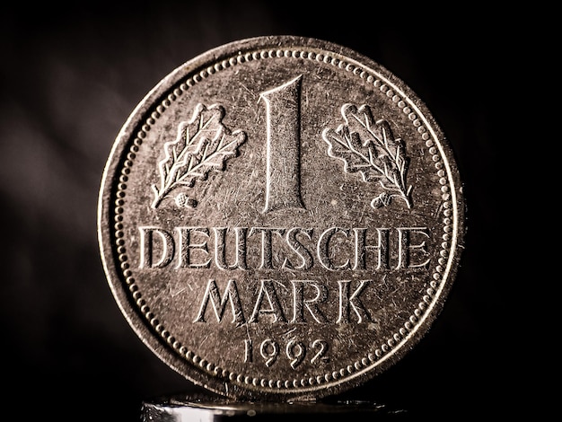 Extreme close-up of one deutsche mark coin against black background