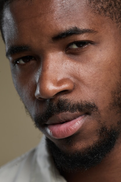 Extreme close up portrait of handsome africanamerican man looking at camera