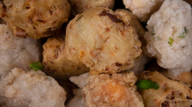 Extreme close up variation of indonesian fritters in a rattan bowl