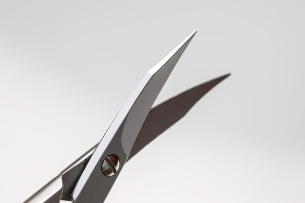 An extreme close up view of metal nail clippers used in self body care small hand tool