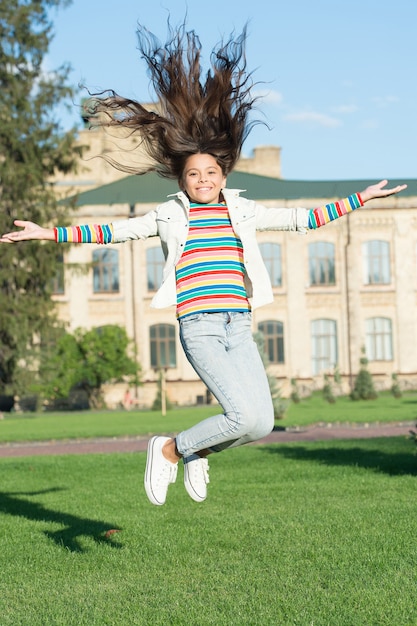 Extreme energy. Freedom concept. Schoolgirl back to school. Childhood happiness. Smart small happy girl ready to study. fashion and beauty. Happiness and joy. Carefree and cheerful. Feeling free.