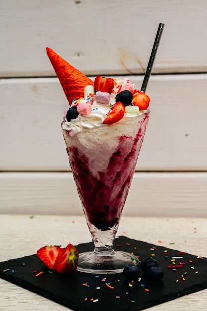 Extreme milkshake or freak shake with strawberry