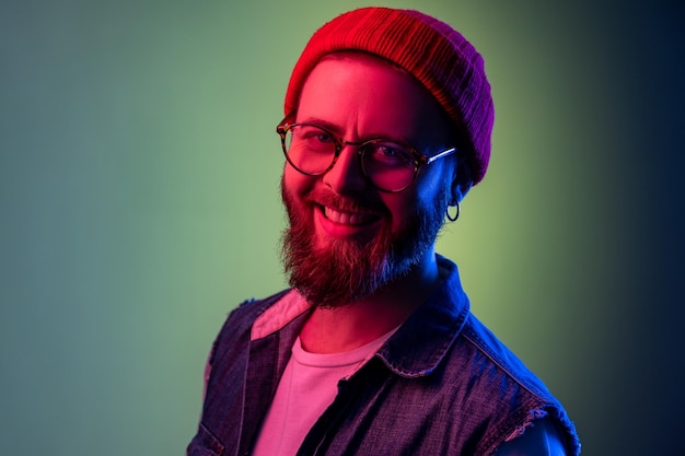 Extremely happy bearded hipster man looking at camera with toothy smile optimism success