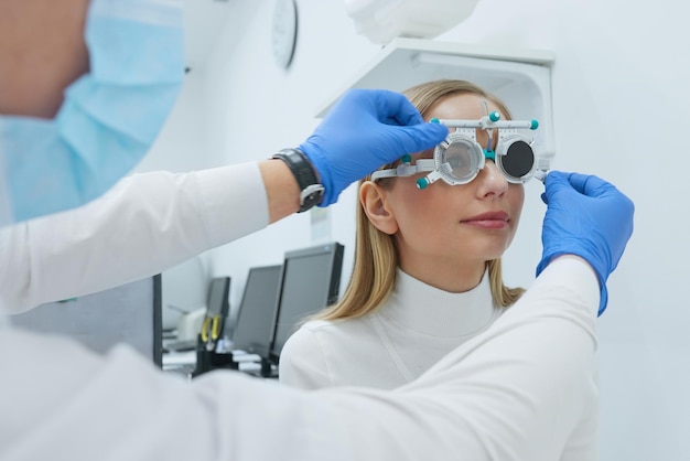 Eye Exam Woman In Glasses Checking Eyesight At Clinic